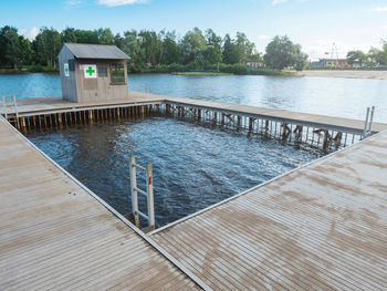 Square swimming pool with mole and small lifeguard tower on kamencove jezero alum lake. comutov town