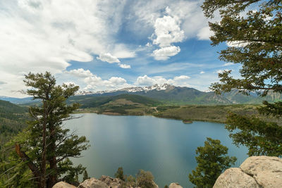 Scenic view of lake and mountains against sky