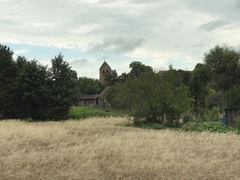 House on field against sky
