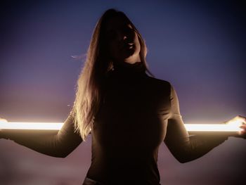 Woman standing against sky
