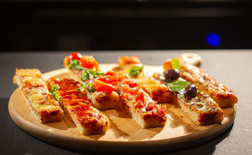 Close-up of pizza served on table