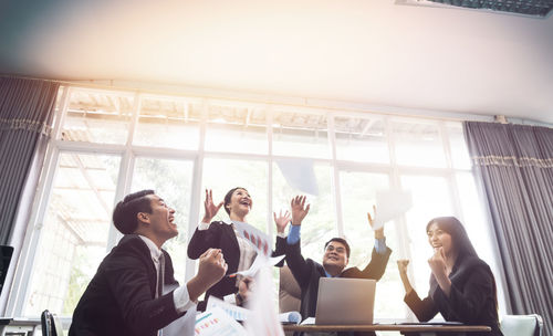 Low angle view of people working in office