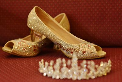 Close-up of high heels and tiara