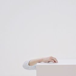 Midsection of woman against white background