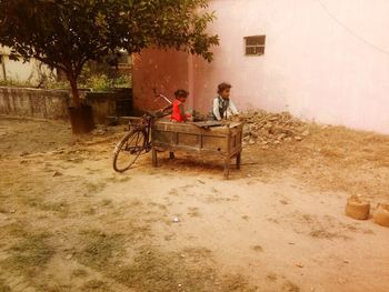 Bicycle in yard against building