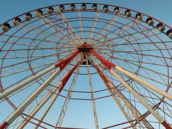 Low angle view of ferris wheel against sky