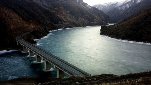 High angle view of bridge passing through mountains