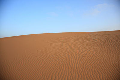 Scenic view of desert against sky