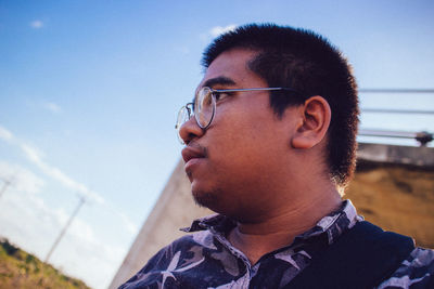 Portrait of young man looking away