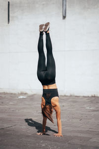 Full length of woman exercising outdoors