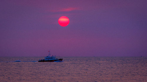 Scenic view of sea against clear sky during sunset