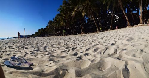 Panoramic view of man on beach against sky