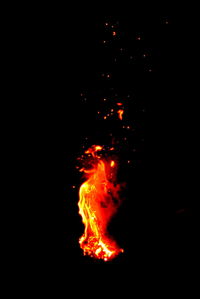 Bonfire at night against black background