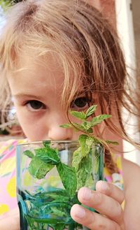 Close-up portrait of a girl holding ice cream