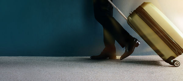 Low section of woman standing on wall