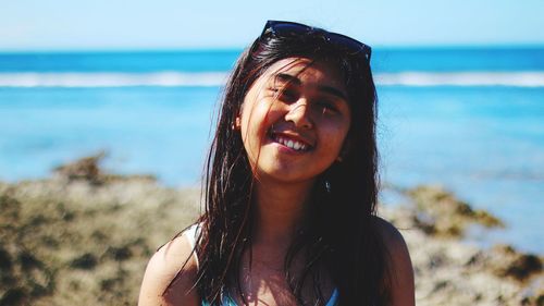 Portrait of smiling young man on beach