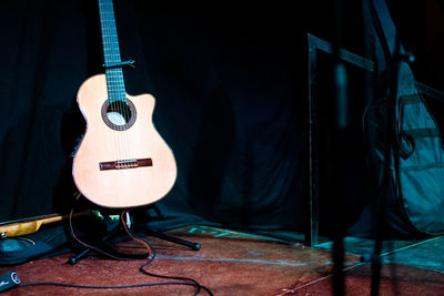 Close-up of guitar on stage