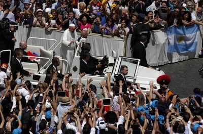 High angle view of people sitting on tiled floor