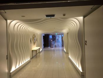 Illuminated corridor of building