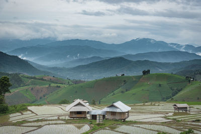 Scenic view of landscape and mountains against sky