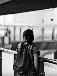 Rear view of a woman against blurred background