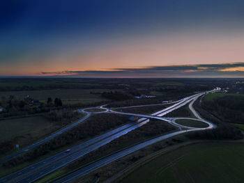 An aerial view of a junction on the a14 trunk road at dawn in suffolk, uk