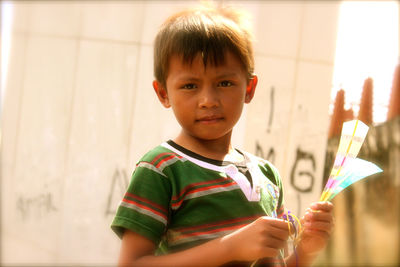 Portrait of boy holding ice cream