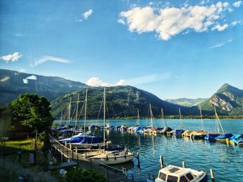 Boats moored at harbor