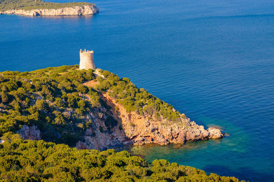 High angle view of rocks by sea