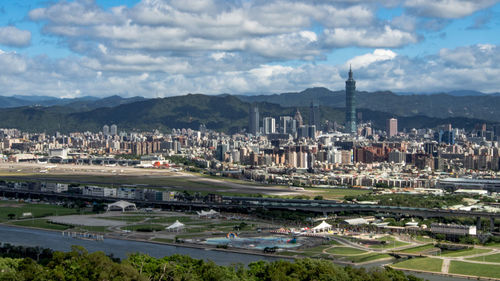 High angle view of buildings in city against sky