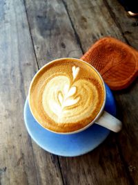 High angle view of coffee cup on table