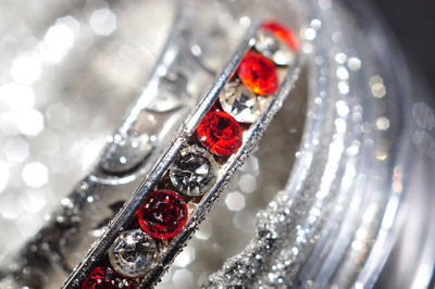 Close-up of red and silver bangles