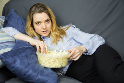 Young woman sitting in bowl