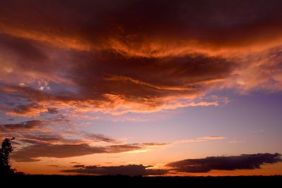 Low angle view of dramatic sky during sunset