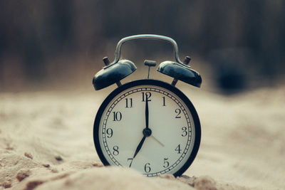 Close-up of clock on table