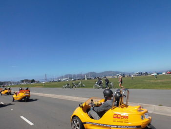 Cars on road against sky