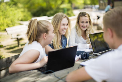 Teenagers studying together