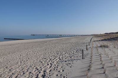 Scenic view of sea against clear blue sky