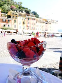 Close-up of strawberry on table against sky