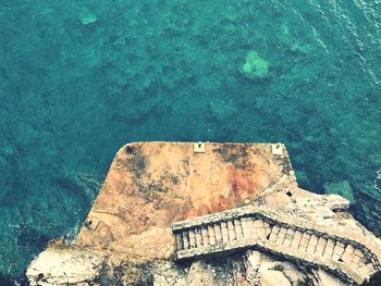 High angle view of rock on sea