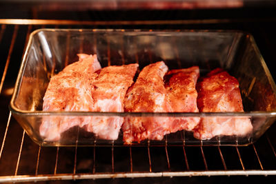 High angle view of meat on barbecue grill