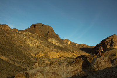 Scenic view of mountains against clear blue sky