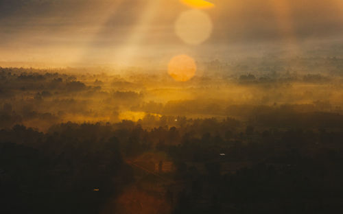 Scenic view of landscape against sky during sunset