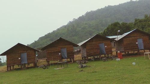 Houses on grassy field