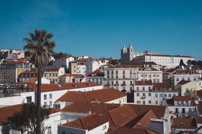 Buildings in city against sky