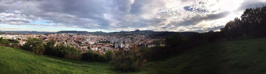 Scenic view of landscape against cloudy sky