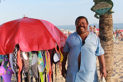 Portrait of a smiling young man standing outdoors