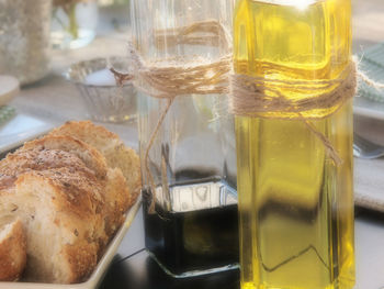 Extra virgin olive oil with bread on table