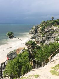 High angle view of trees by sea against sky