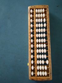 High angle view of abacus calculator on table
